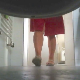 A hidden camera mounted beneath a toilet records a woman entering the bathroom, sitting down on the toilet, and taking a soft, gooey shit with great sounds. Only her legs are visible thoughout the clip. Presented in 720P HD. About 1.5 minutes.